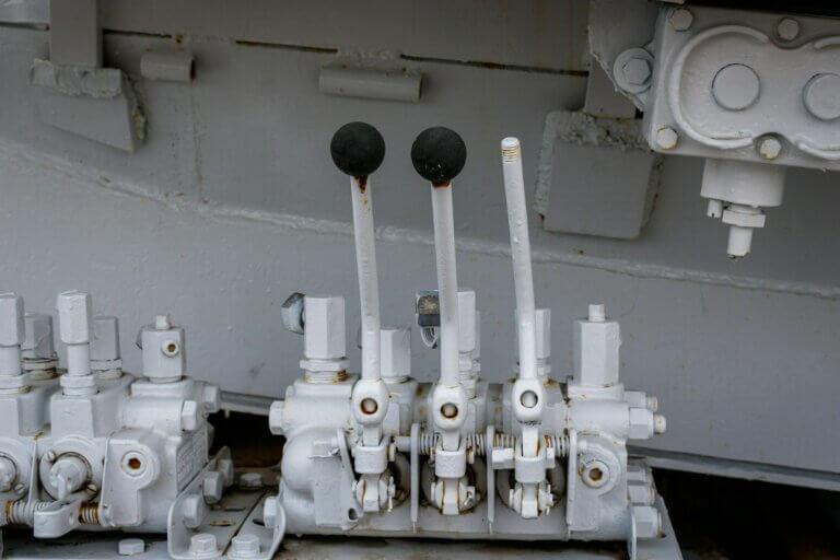 a bunch of pipes and valves on a ship
